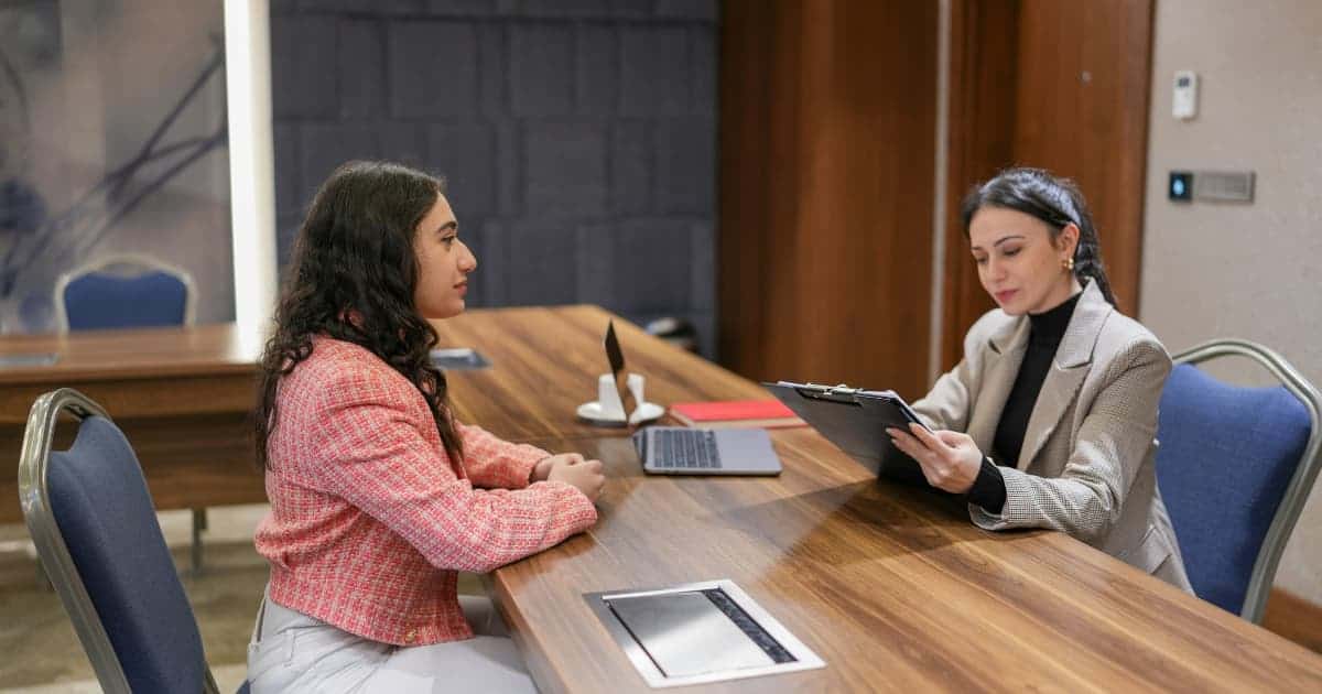 A Harvard University campus photo, symbolizing the focus of the interview question.