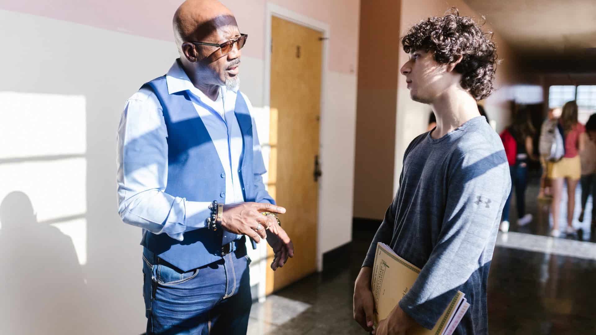 advisor discussing options and giving college admission advice to a student