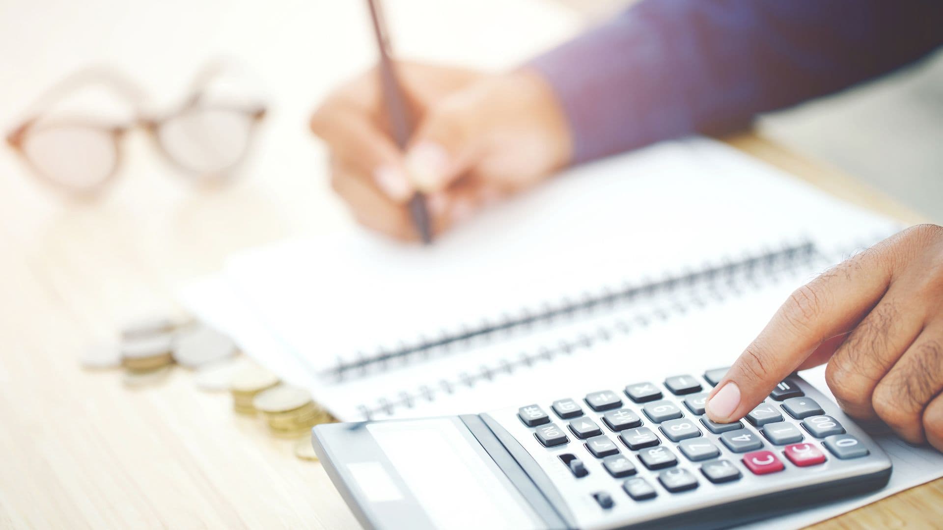 student working on understanding how much money he will need for college