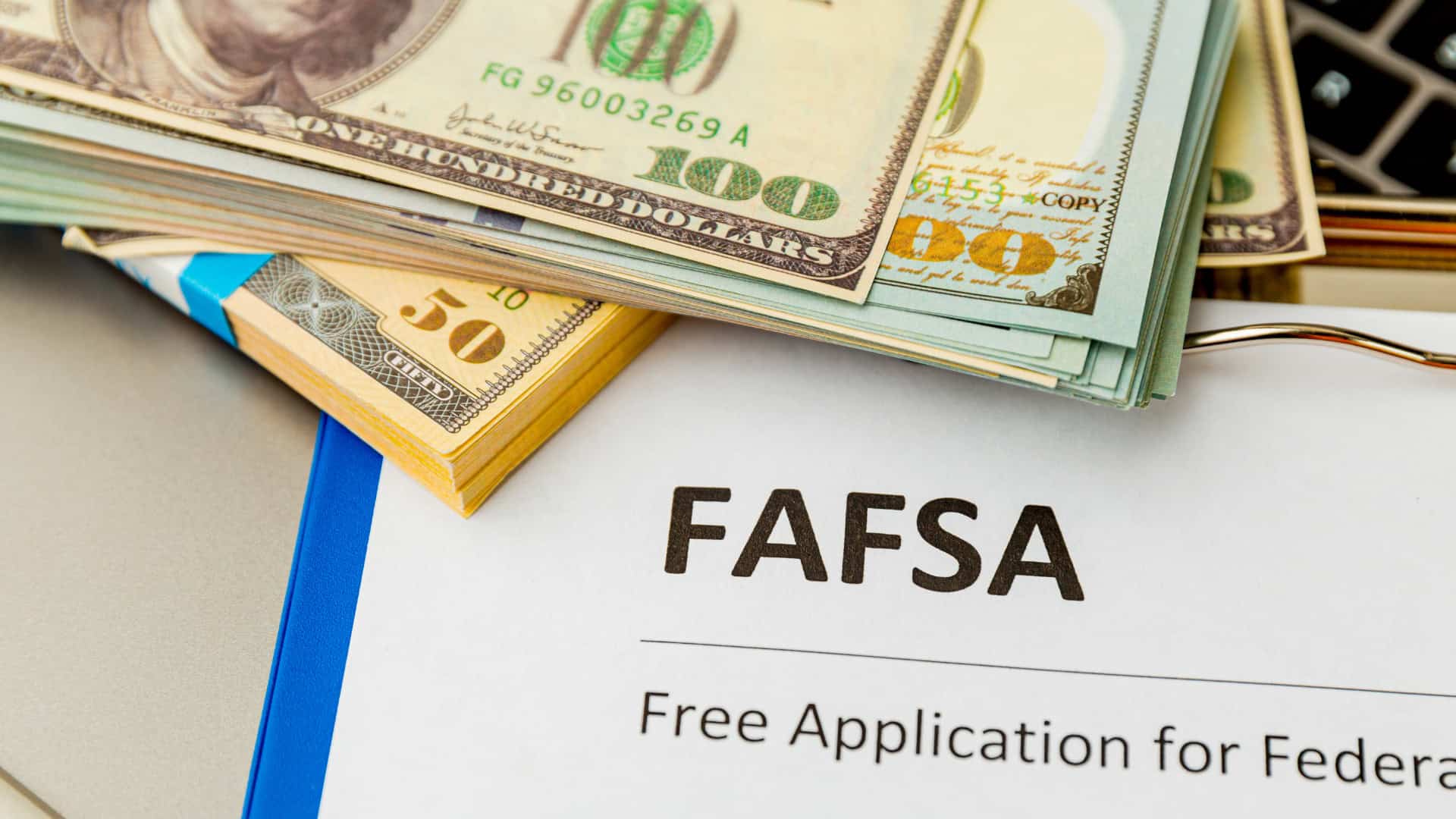 fafsa form laid out of table with money