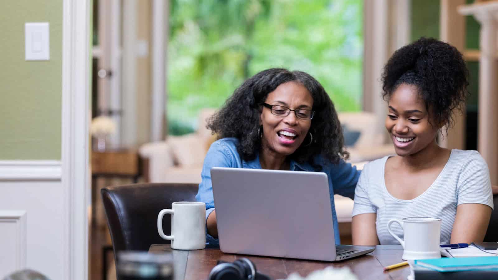 woman sitting with her child guiding her college admission process