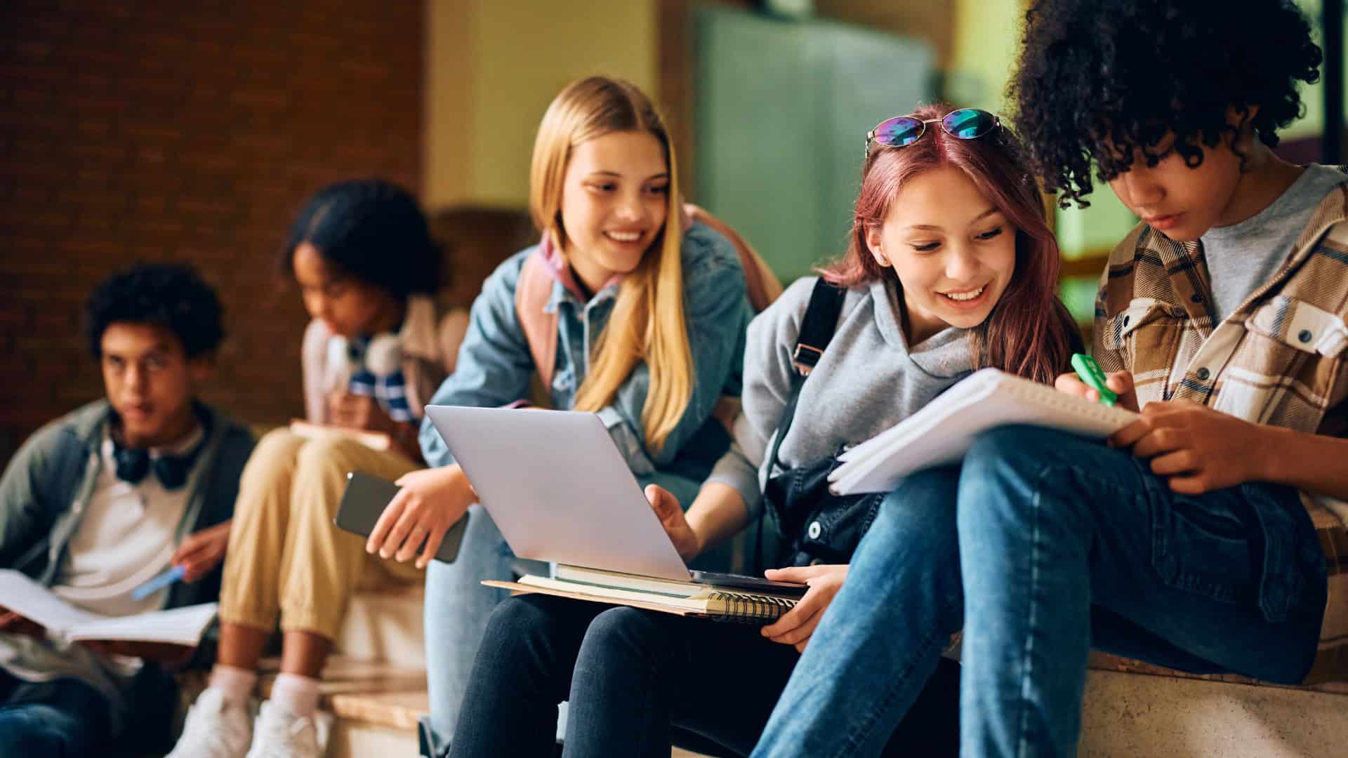 a group of students sitting together discussing about their likes and dislikes